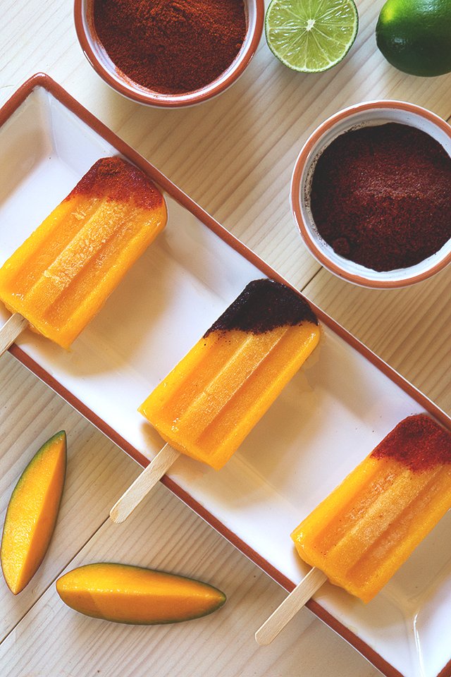 Tequila-Spiked Mango Popsicles with Chile // HonestlyYUM