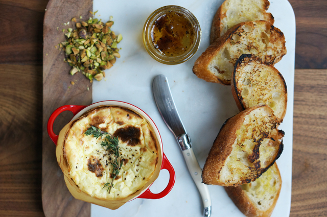 Baked ricotta dip with truffle honey and pistachios