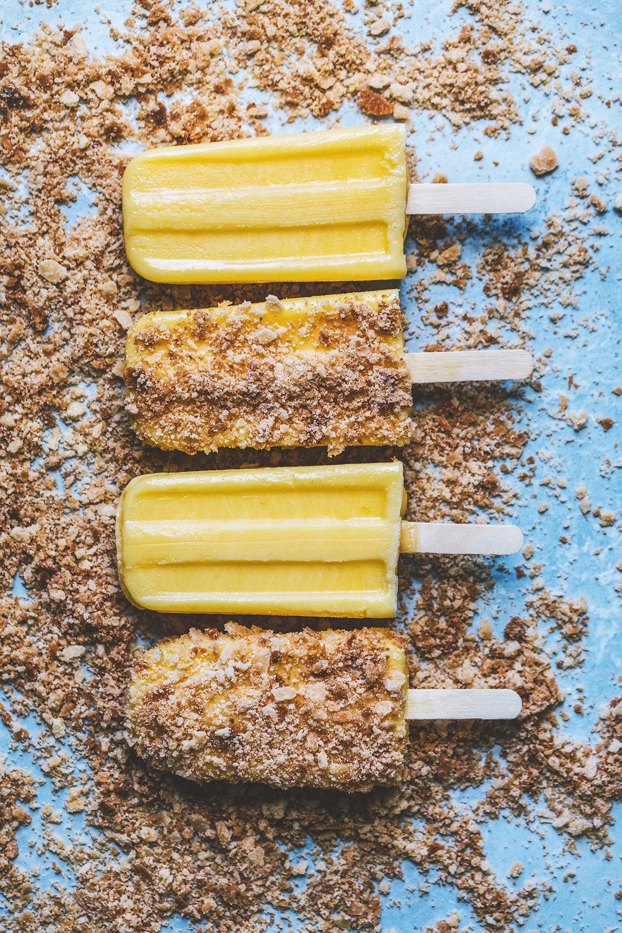 Lemon Bar Popsicles with Shortbread Crumble | HonestlyYUM (honestlyyum.com)