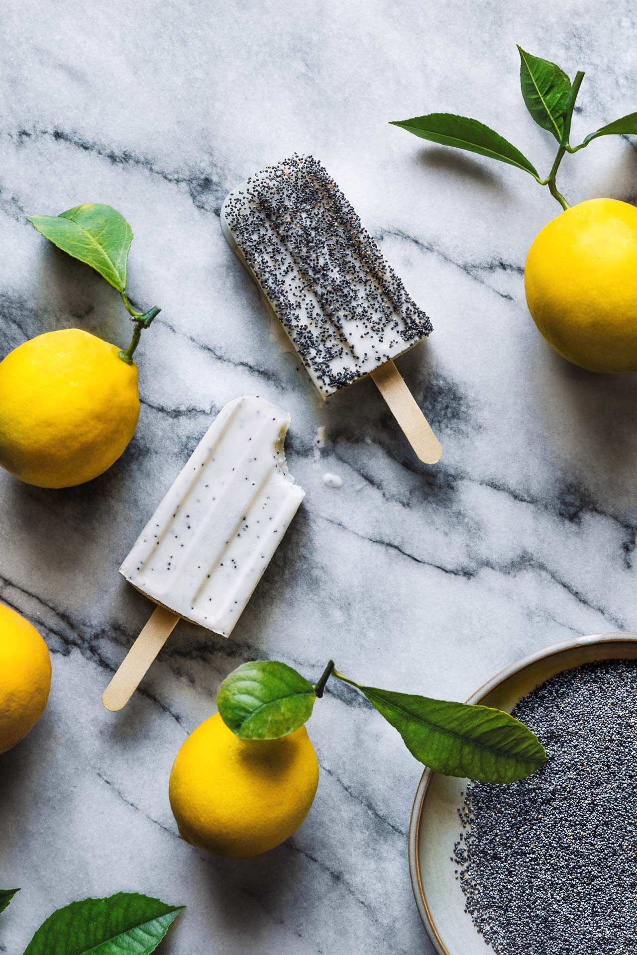 Lemon Poppy Seed Popsicles | HonestlyYUM (honestlyyum.com) #popsicleweek #summer #recipes #popsicles